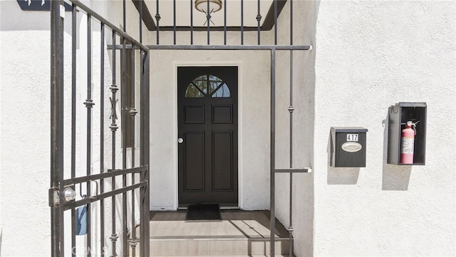 413 E 81st St, Los Angeles, CA 90003 - view of exterior entry featuring stucco siding