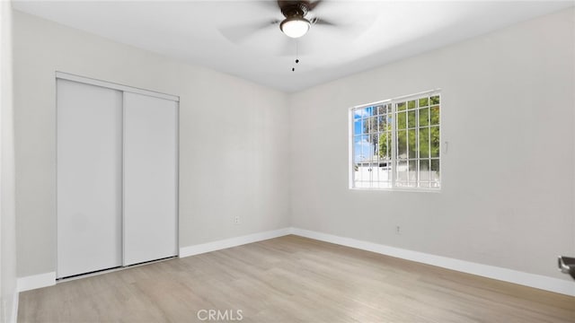 413 E 81st St, Los Angeles, CA 90003 - unfurnished bedroom featuring wood finished floors, baseboards, a closet, and ceiling fan