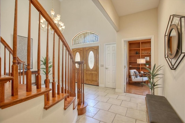 455 Chiswick Way, Cambria, CA 93428 - entrance foyer featuring stairs, light tile patterned flooring, a towering ceiling, and baseboards
