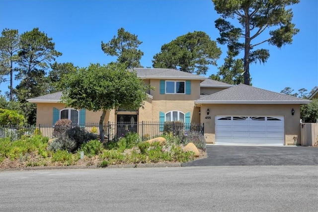 455 Chiswick Way, Cambria, CA 93428 - view of front facade featuring stucco siding, a garage, and asphalt driveway