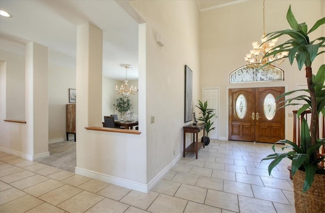 455 Chiswick Way, Cambria, CA 93428 - entrance foyer featuring a chandelier, light tile patterned flooring, baseboards, and a high ceiling