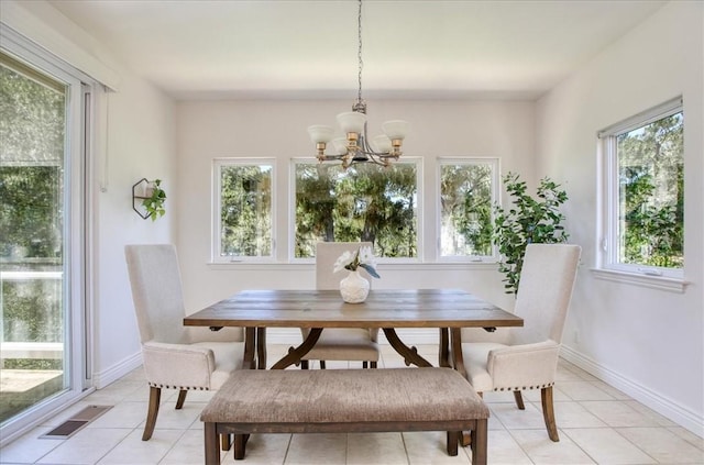 455 Chiswick Way, Cambria, CA 93428 - dining area featuring a chandelier, light tile patterned floors, and baseboards