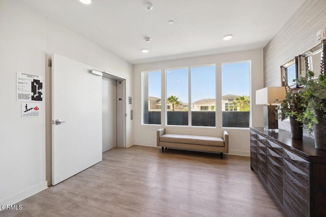 2800 Wagon Wheel Rd Unit 304, Oxnard, CA 93036 - living area with light wood-style flooring, recessed lighting, baseboards, and elevator