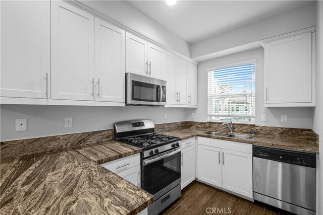 4617 Alekona Ct, Cypress, CA 90630 - kitchen with stainless steel appliances, white cabinets, dark wood-style floors, and recessed lighting