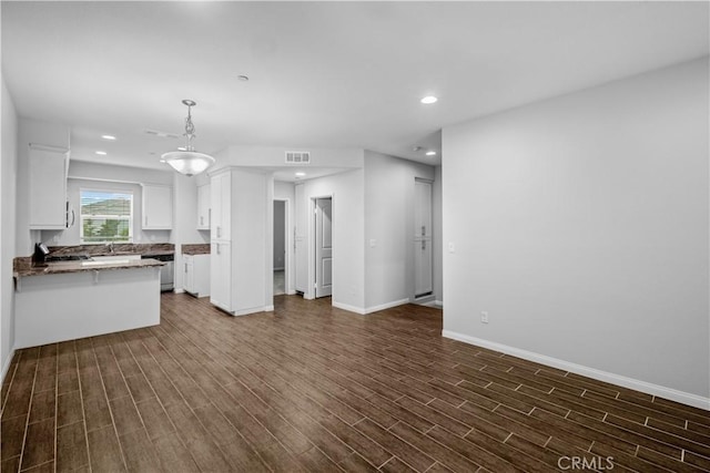 4617 Alekona Ct, Cypress, CA 90630 - unfurnished living room featuring dark wood finished floors and recessed lighting
