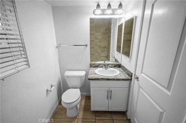 4617 Alekona Ct, Cypress, CA 90630 - bathroom with vanity, a tile shower, and tile patterned flooring