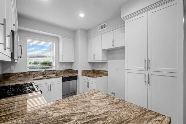 4617 Alekona Ct, Cypress, CA 90630 - kitchen featuring stainless steel appliances, dark stone counters, white cabinetry, and recessed lighting