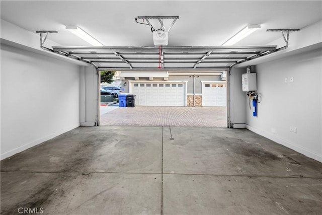 4617 Alekona Ct, Cypress, CA 90630 - garage with water heater and a garage door opener