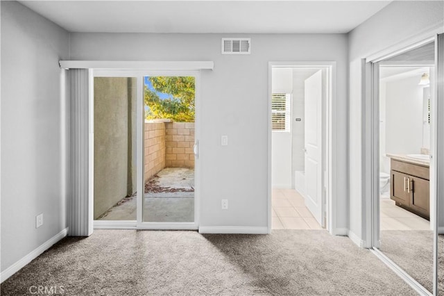 4615 Alekona Ct, Cypress, CA 90630 - unfurnished bedroom with multiple windows, access to outside, light carpet, and ensuite bathroom