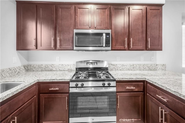4615 Alekona Ct, Cypress, CA 90630 - kitchen with appliances with stainless steel finishes and light stone countertops