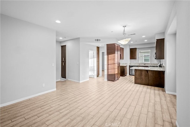 4615 Alekona Ct, Cypress, CA 90630 - kitchen with open floor plan, light wood-style flooring, dark brown cabinets, recessed lighting, and a peninsula
