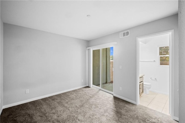 4615 Alekona Ct, Cypress, CA 90630 - unfurnished bedroom featuring carpet floors, connected bathroom, and tile patterned flooring