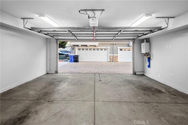 4615 Alekona Ct, Cypress, CA 90630 - garage with water heater and a garage door opener