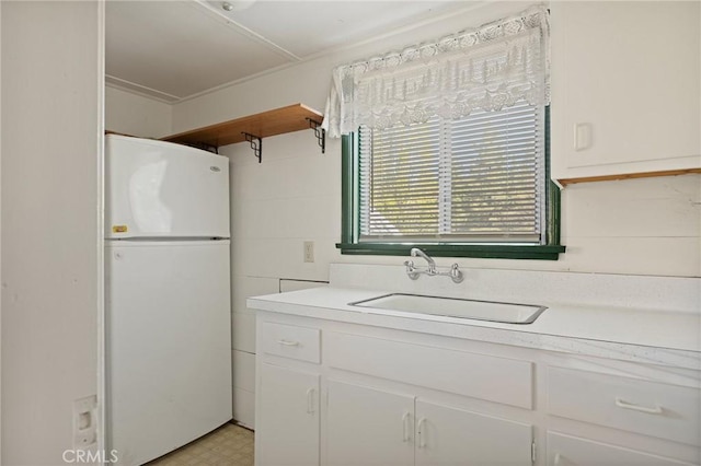 32930 Rim Of The World, Running Springs, CA 92382 - kitchen with freestanding refrigerator, a sink, white cabinetry, and light countertops