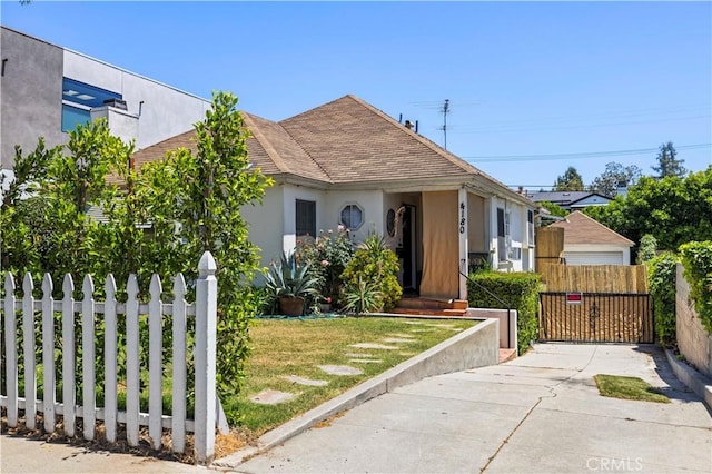 4180 Tujunga Ave, Studio City, CA 91604 - bungalow with stucco siding, a shingled roof, and a gate