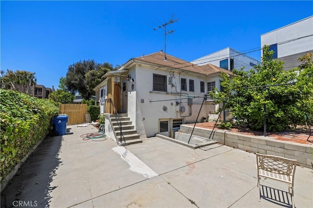 4180 Tujunga Ave, Studio City, CA 91604 - back of property with stucco siding, a patio area, and roof with shingles