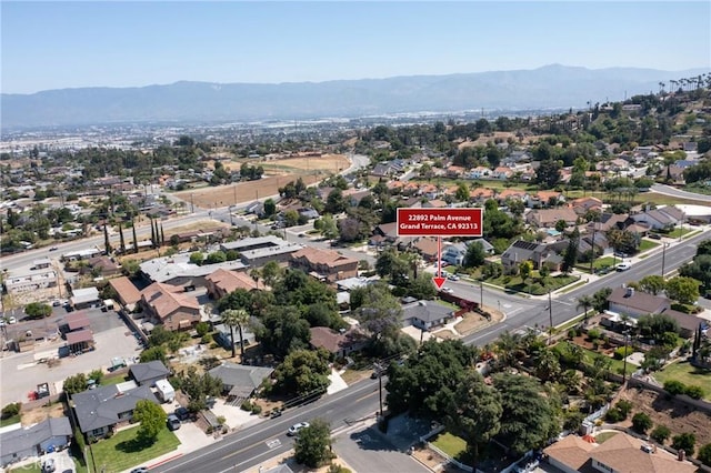 22892 Palm Ave, Grand Terrace, CA 92313 - aerial view of property's location featuring a mountain backdrop and nearby suburban area
