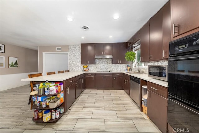 22892 Palm Ave, Grand Terrace, CA 92313 - kitchen with black appliances, a sink, under cabinet range hood, light countertops, and recessed lighting