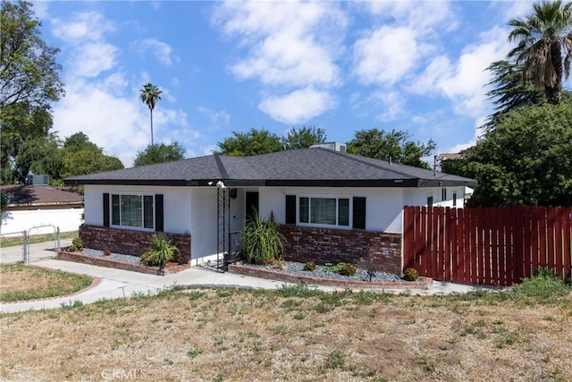 22892 Palm Ave, Grand Terrace, CA 92313 - view of front facade featuring stucco siding, brick siding, and a gate