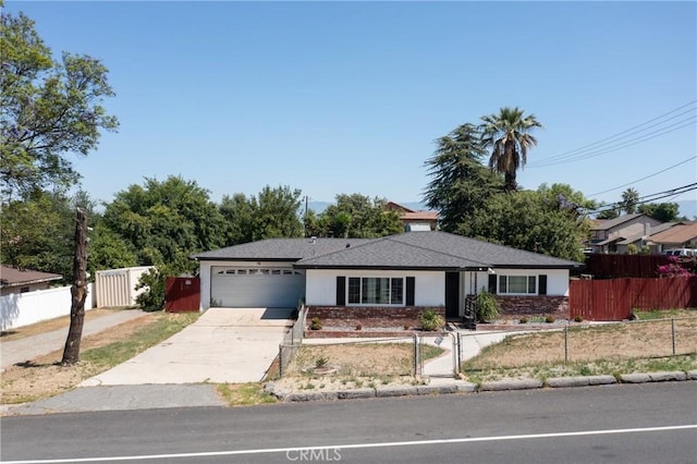 22892 Palm Ave, Grand Terrace, CA 92313 - ranch-style house featuring a garage, a fenced front yard, and concrete driveway