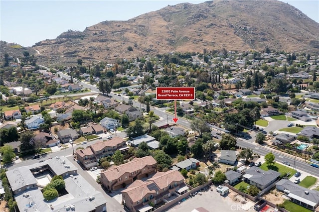 22892 Palm Ave, Grand Terrace, CA 92313 - aerial view of property and surrounding area with a mountain backdrop and nearby suburban area