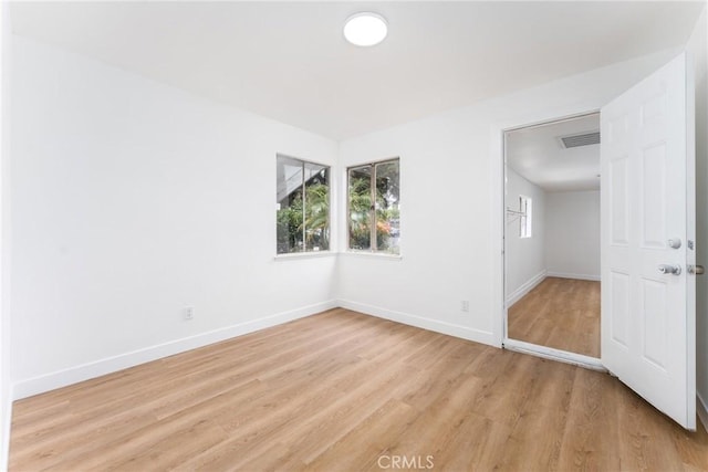 1089 W 2nd St, Rialto, CA 92376 - empty room featuring light wood-style flooring and baseboards