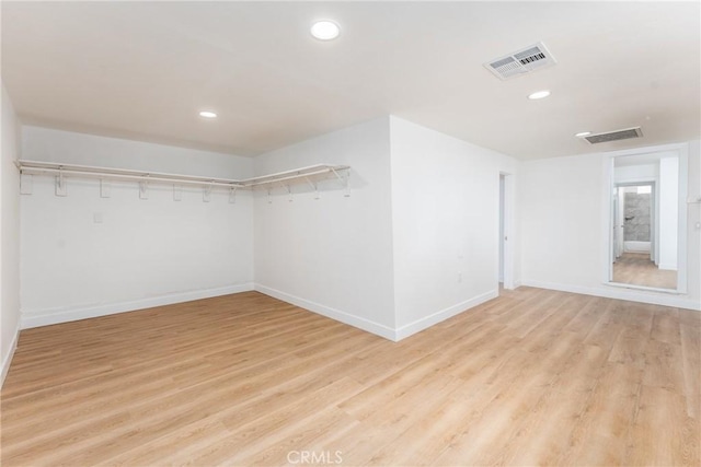1089 W 2nd St, Rialto, CA 92376 - unfurnished room with light wood finished floors, baseboards, and recessed lighting