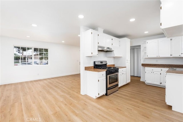 1089 W 2nd St, Rialto, CA 92376 - kitchen featuring stainless steel range with gas cooktop, under cabinet range hood, open shelves, white cabinetry, and recessed lighting