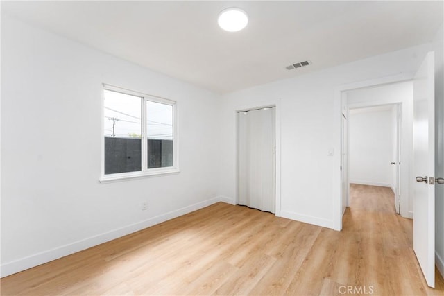 1089 W 2nd St, Rialto, CA 92376 - unfurnished bedroom featuring light wood-style flooring, baseboards, and a closet