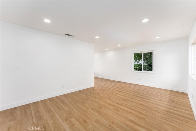 1089 W 2nd St, Rialto, CA 92376 - unfurnished room with baseboards, recessed lighting, and light wood finished floors