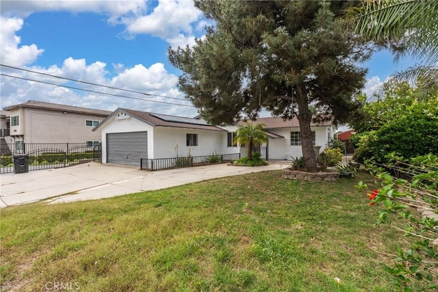 1089 W 2nd St, Rialto, CA 92376 - view of front of house with stucco siding, driveway, solar panels, and an attached garage