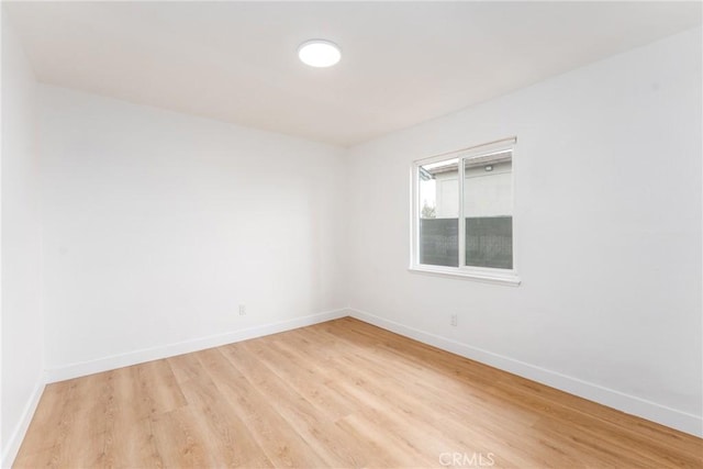 1089 W 2nd St, Rialto, CA 92376 - empty room featuring light wood finished floors and baseboards