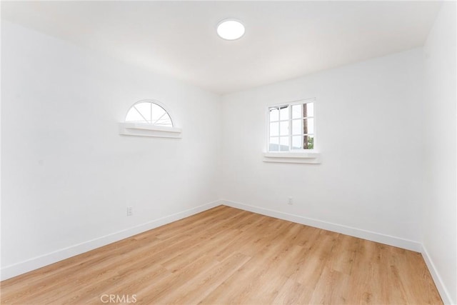 1089 W 2nd St, Rialto, CA 92376 - spare room with plenty of natural light, baseboards, and light wood-style flooring