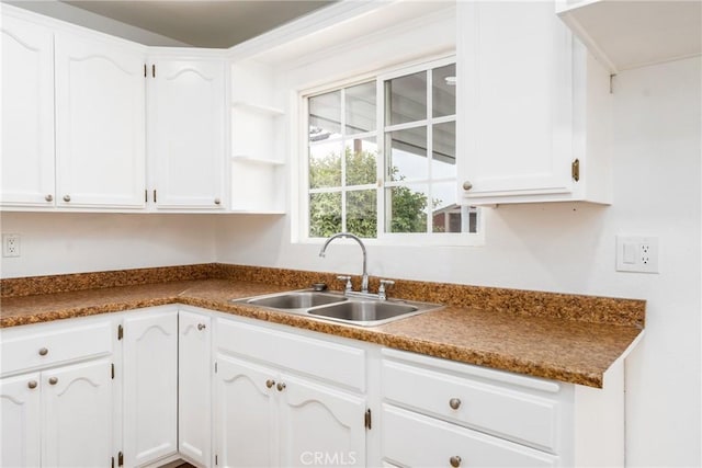 1089 W 2nd St, Rialto, CA 92376 - kitchen with a sink, white cabinetry, and open shelves
