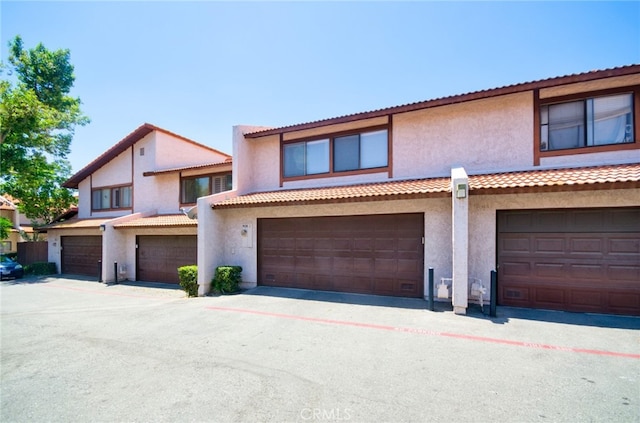 928 N Redding Way Unit D, Upland, CA 91786 - view of front of property with stucco siding and an attached garage