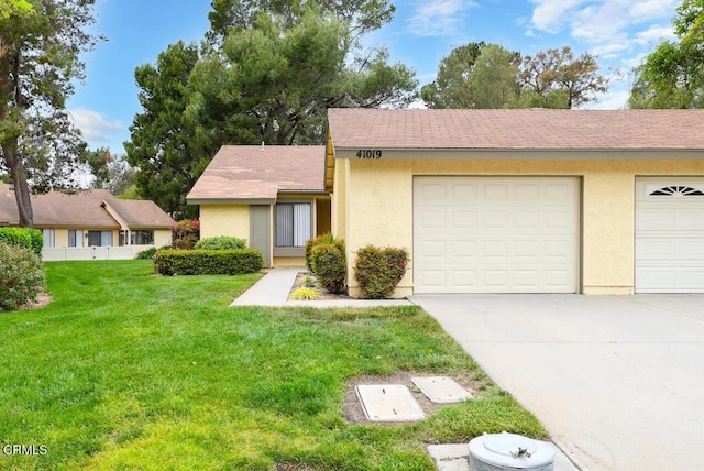 41019 Village 41, Camarillo, CA 93012 - view of front of house with driveway, a front lawn, stucco siding, and an attached garage