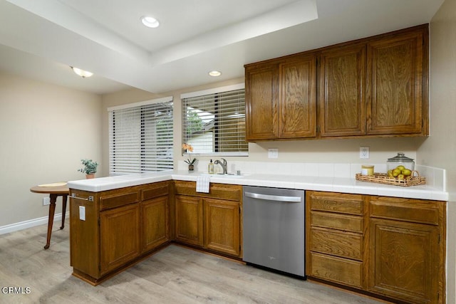 41019 Village 41, Camarillo, CA 93012 - kitchen featuring dishwasher, light wood-type flooring, a peninsula, brown cabinetry, and recessed lighting
