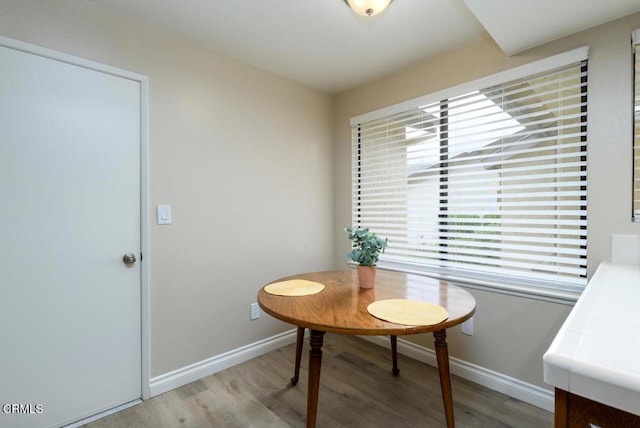 41019 Village 41, Camarillo, CA 93012 - dining area featuring healthy amount of natural light, wood finished floors, and baseboards