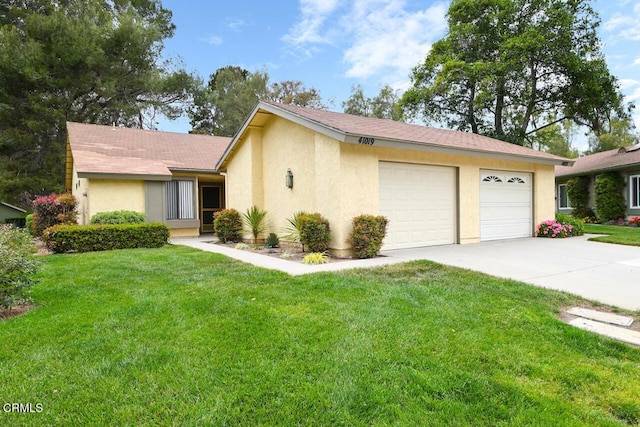 41019 Village 41, Camarillo, CA 93012 - single story home with concrete driveway, stucco siding, a front yard, and a garage