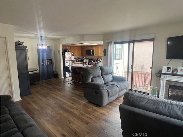 187 Woodbine Ln, Nipomo, CA 93444 - living area with dark wood-type flooring and a tiled fireplace