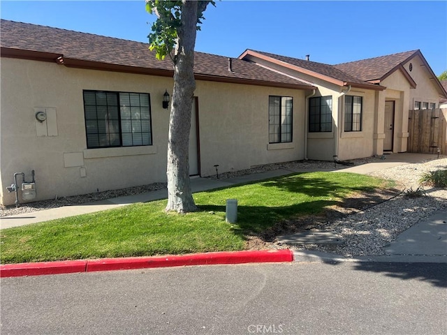 187 Woodbine Ln, Nipomo, CA 93444 - view of side of property featuring stucco siding and roof with shingles