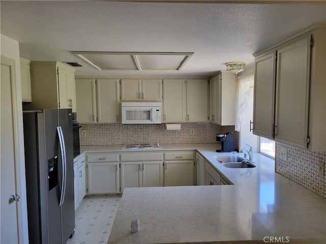2368 Beechwood Way, Madera, CA 93637 - kitchen featuring white appliances, a sink, light countertops, and backsplash