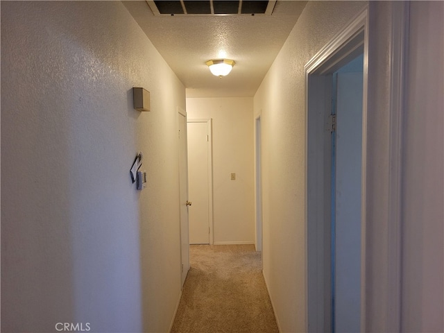 2368 Beechwood Way, Madera, CA 93637 - hall featuring a textured wall, a textured ceiling, and light carpet