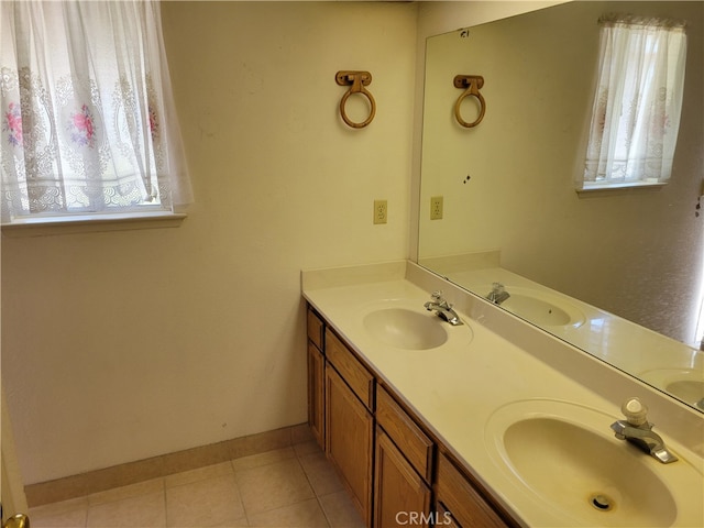 2368 Beechwood Way, Madera, CA 93637 - full bath with double vanity, tile patterned floors, and baseboards