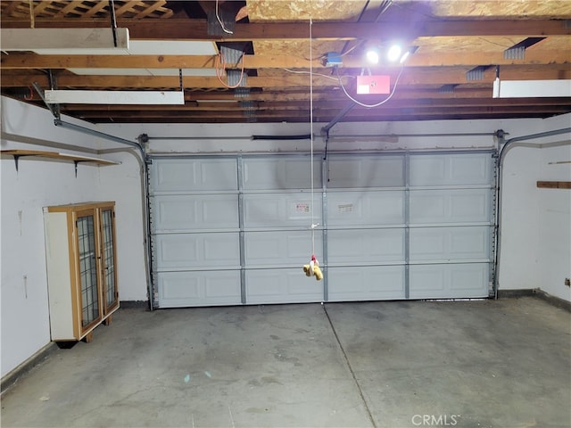 2368 Beechwood Way, Madera, CA 93637 - garage featuring french doors, baseboards, and a garage door opener