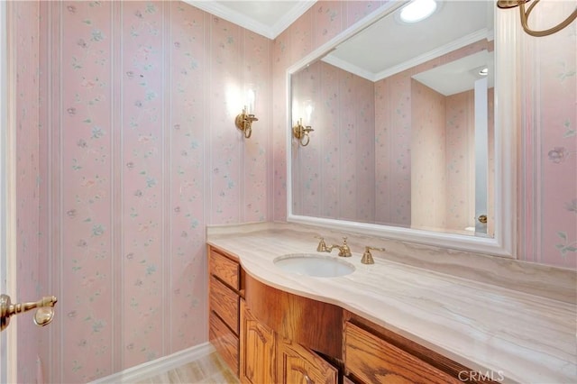 19371 Woodlands Dr, Huntington Beach, CA 92648 - bathroom featuring ornamental molding, vanity, and wallpapered walls