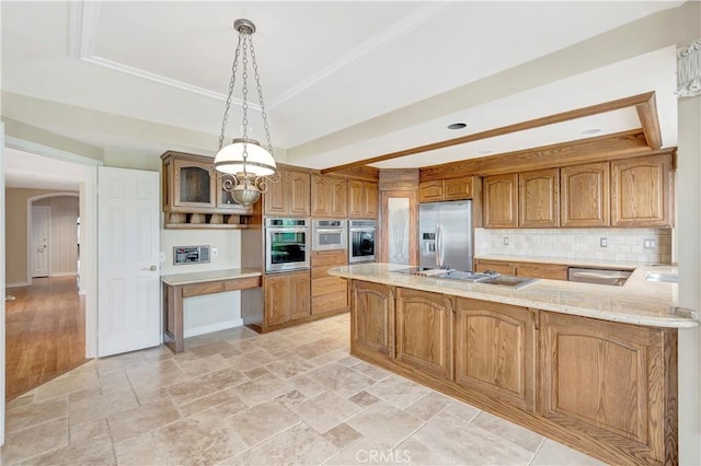 19371 Woodlands Dr, Huntington Beach, CA 92648 - kitchen with appliances with stainless steel finishes, decorative backsplash, a raised ceiling, brown cabinetry, and a peninsula