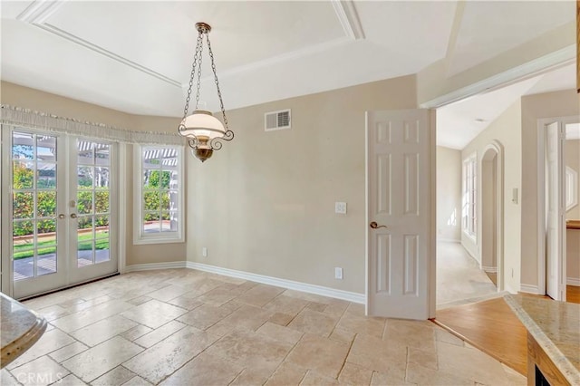 19371 Woodlands Dr, Huntington Beach, CA 92648 - unfurnished dining area with stone tile flooring, baseboards, and french doors
