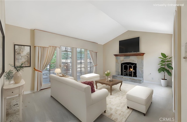 19371 Woodlands Dr, Huntington Beach, CA 92648 - living room featuring vaulted ceiling, a stone fireplace, and baseboards