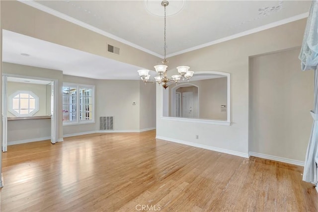 19371 Woodlands Dr, Huntington Beach, CA 92648 - spare room with a chandelier, light wood finished floors, baseboards, and crown molding